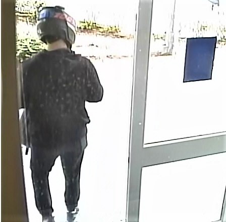 Rear photo of offender leaving the bank