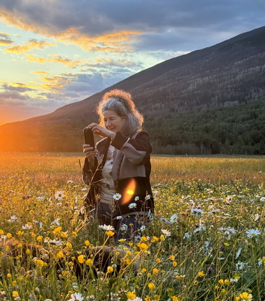 Photo of Monica Gianina Marcu in a field of flowers