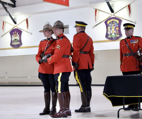 Constable Tara Joubert being presented with her badge by her father at Depot