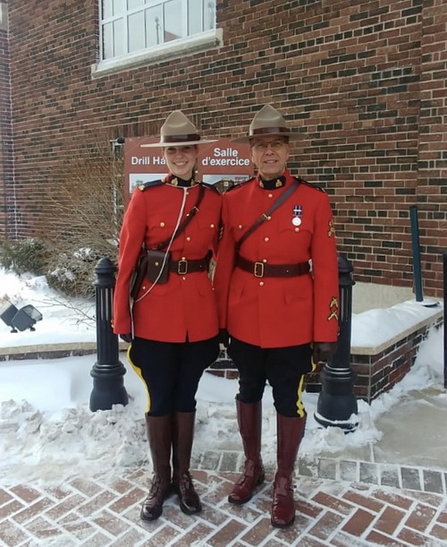 Constable Tara Joubert and her father standing outside Depot wearing the Red Serge]