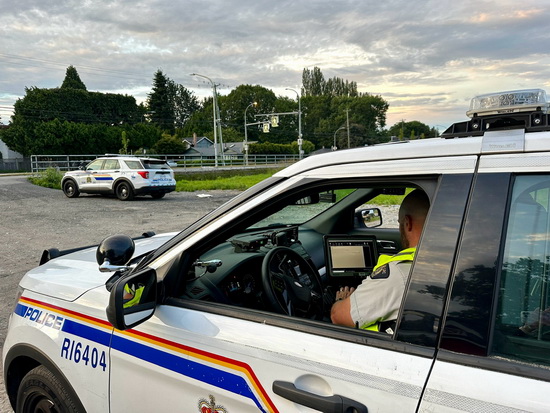 Richmond RCMP officer inside a marked police vehicle