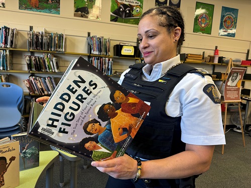 Inspector Veronica Fox reading <q>Hidden Figures</q> at a Diversity Event