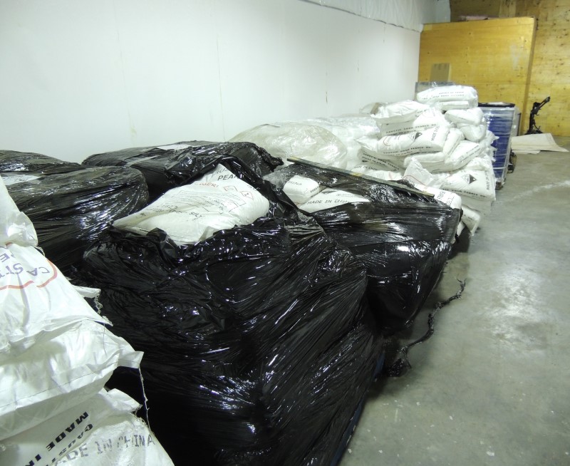 Pallets of bags and drums of chemicals located and seized during the execution of the search warrant.