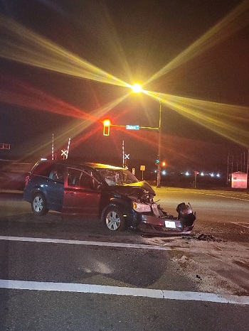 Photo of crashed minivan in intersection