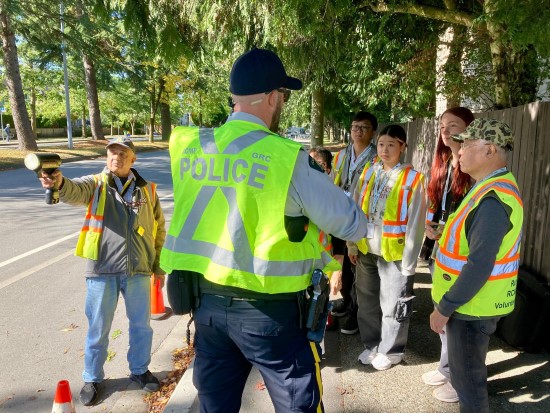 Richmond RCMP officer instructing volunteers