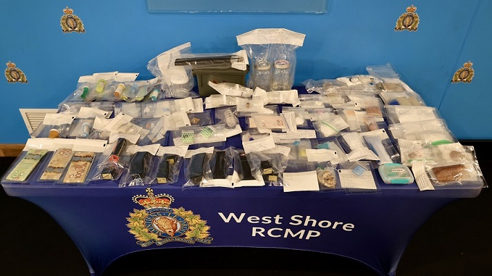 Photo of drugs, cash and weapons seized by police