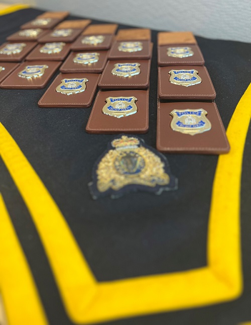 RCMP badges on a ceremonial table