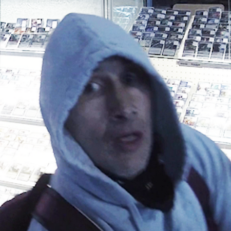 Photo of the suspect wearing a grey hoodie