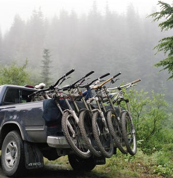 photo of pickup truck with bikes in back