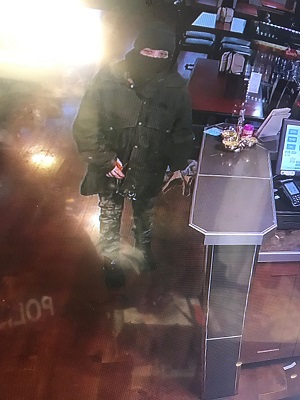 photo of suspect with face covering