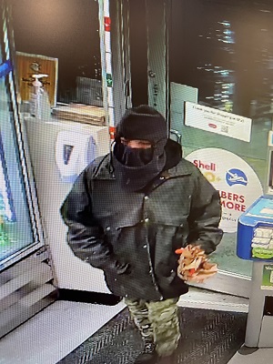 Photo of suspect with face covering