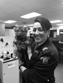 Staff Sgt. Perceival with a german shepard puppy