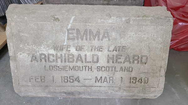 Gravestone that reads "Emma, wife of the late Archibald Heard, Lossiemouth, Scotland, Feb.1 1854 - Mar.1 1940"