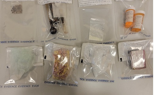 Various drugs (fentanyl, crystal meth, pills) seized with drug paraphernalia