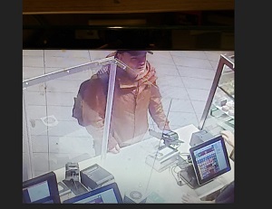 Suspect who threw a cold cup of coffee at an employee 