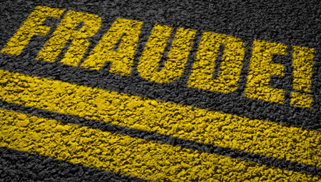 Le mot "fraude" en écriture jaune sur fond noir