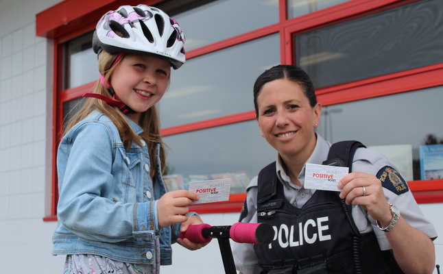 Photo of young girl with police officer