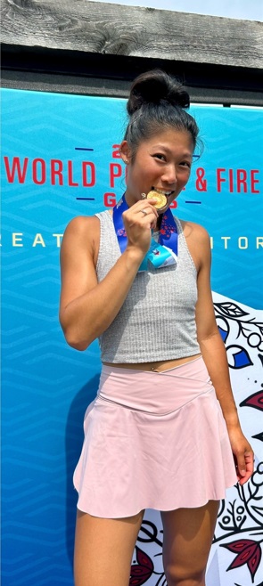 Cst Jenny Fu holding gold medal 