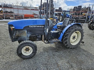 Blue New Holland brand tractor - older style 