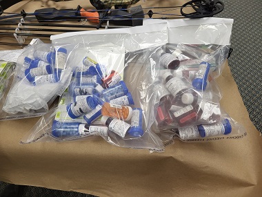 Bags of pill bottles with suspected illicit and prescription drugs